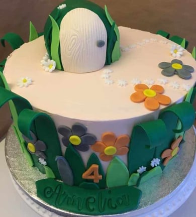 a cake with a white cake topperf on it