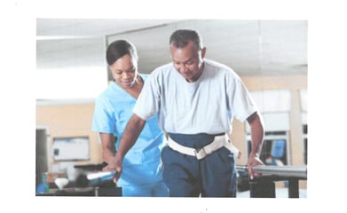 an occupational therapist and a patient at home.