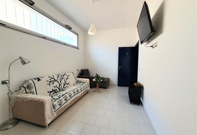 a couch with a tv and a television