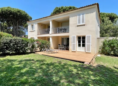 a house with a deck and decking area
