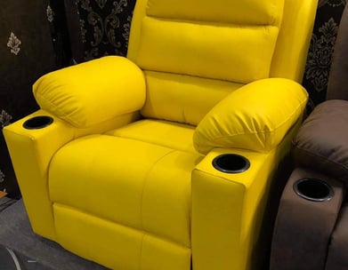 A yellow recliner by afsar sofa repair