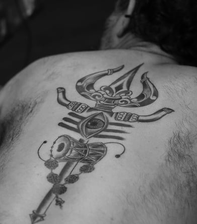 Spiritual Trishul and damru tattoo design by Dudo’s Tattoos and Piercing Hyderabad