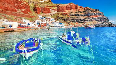 Santorini: Iconic white-washed buildings, blue domes, and unforgettable sunsets