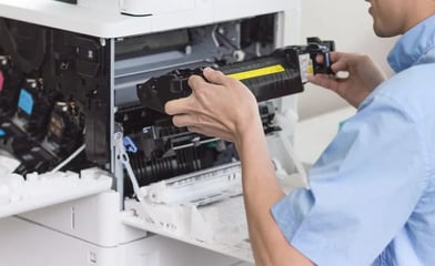 Technician repairing printer