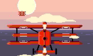 a red biplane flying over the ocean
