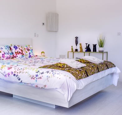 Bedroom with king size bed, air conditioner, built-in bathroom and television at Domaine Des Lucques
