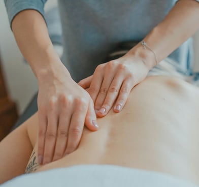 a woman receiving massage by daniel