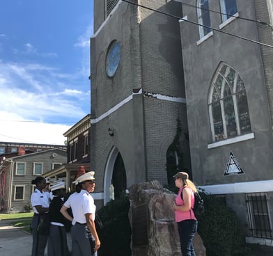 Laura Hooton, right, with students on Black history walking tour outside AME Zion Church of Newburgh