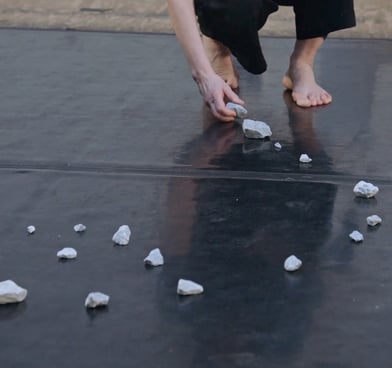 dancer moving stone