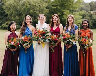 a bridesmaid in a colorful dress with a bouquet of flowers