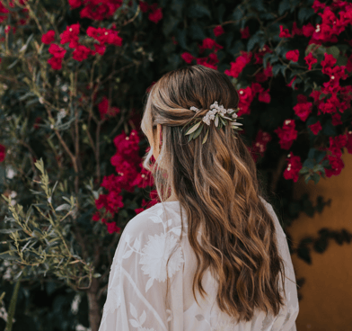 Half up half down wedding hairstyle with natural flowers Hugo Coelho Photography