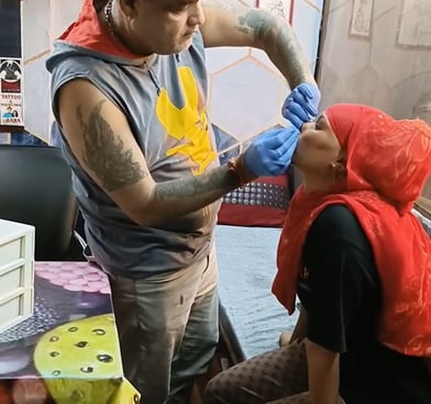 A close-up of a detailed tattoo being inked at Tattoo Baba, showcasing the artist's precision and sk