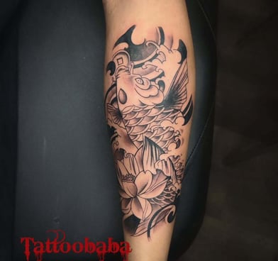 A close-up of a detailed tattoo being inked at Tattoo Baba, showcasing the artist's precision and sk