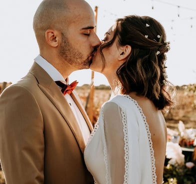 Half-up Half-down boho bridal hairstyle with natural flowers