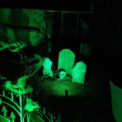 Glowing grave scene at the SweetAz Co. Halloween party in Redland Bay.
