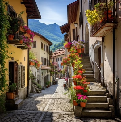 a narrow street with a bunch of flowers in the middle of the street