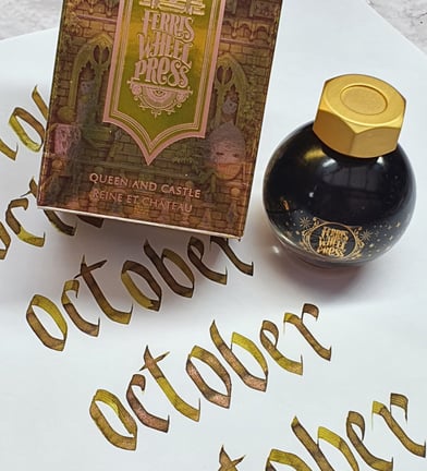 Word October written in gothicized italic using a broad nib with Queen and Castle ink