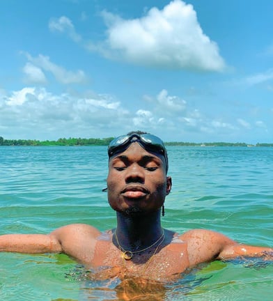 Kofi Dotse relaxing at the beach in Ada