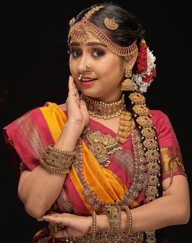 a woman in a traditional indian madisaar sari outfit