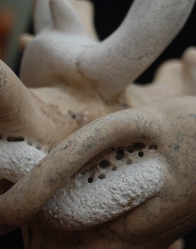 a close up of a sculpture of a woman's face