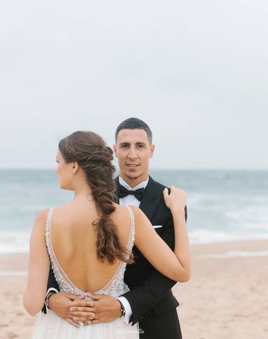 portrait of bride and groom on the beach in Sintra, Portugal