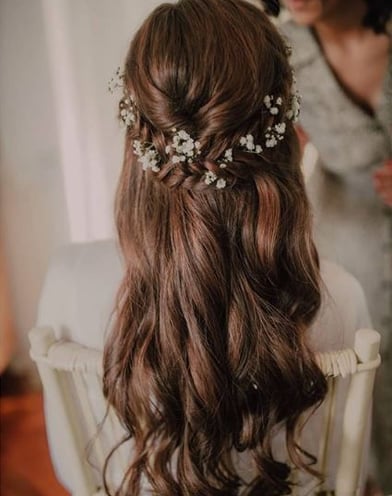 Half up half down braided bridal wedding hair with gypsophila flowers 