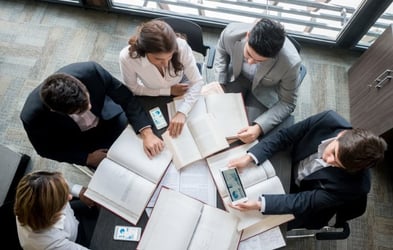 Team analyzing market trends and product positioning strategies – Zyncopra trade support