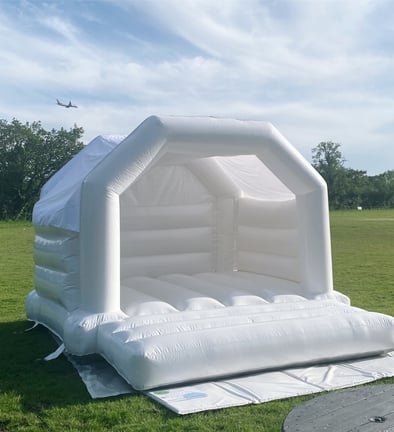 luxury white bouncy castle for hire sussex , surrey & kent birthdays and weddings 