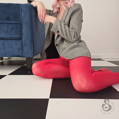 Woman seated in American Apparel Red Opaque Tights