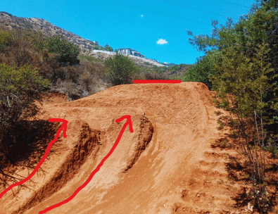 Step-up jump with a lower takeoff and elevated landing built from dirt