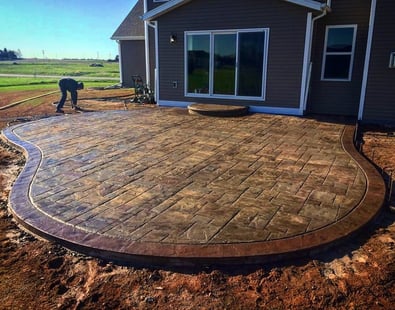 a patio with a brick patio with a brick patio