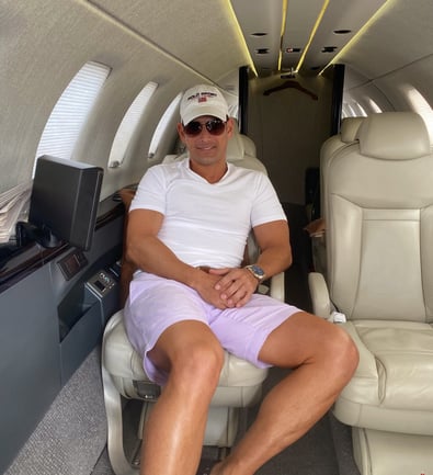 Rick Rockefeller-Silvia sitting in a private jet