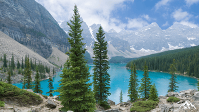 a mountain scene with a lake and mountains in the background