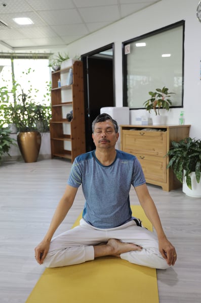 an image of a senior citizen doing yoga 