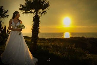 Bride posing at the sunset near beach in Portugal at the Praia D'El Rey Marriott Golf & Beach Resort