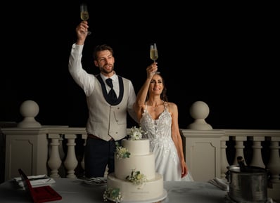 Bride and Groom cheering at the Praia D'El Rey Marriott Golf & Beach Resort