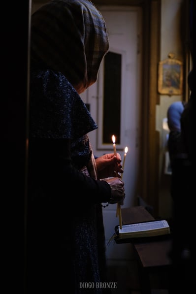 Catholic Chapel woman holding candles
