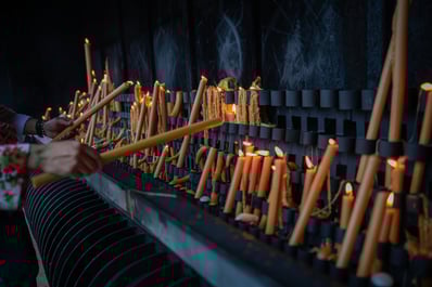 Lighting the candles in Fátima Sanctuary