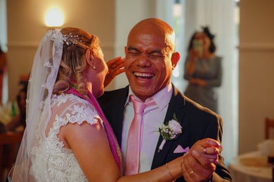Groom smiling during first dance at wedding in Fátima