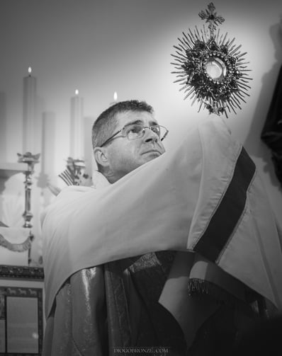 Catholic Priest with Our Lord