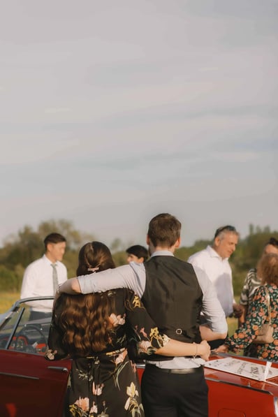 couple embracing each other at a summer wedding