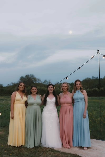 Brides maids photographed under a moonlit sky