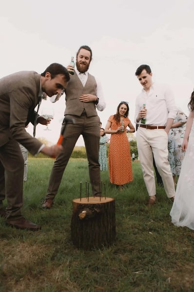 Wedding guests are photographed playing a traditional wedding game