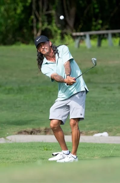 Par Four Golf Club image of Justin Corben hits onto the green during the final day of the Calvin Washington Memorial 50th Ann