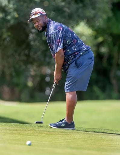Par Four Golf Club image of Lonnie Malone putts on the 4th green during the final day of the Calvin Washington Memorial 50th