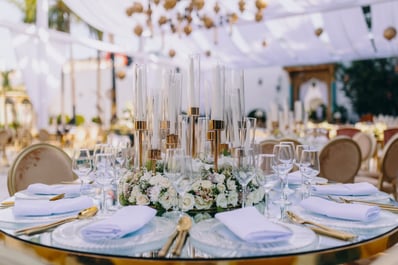 wedding decoration table with candles and flowers in center