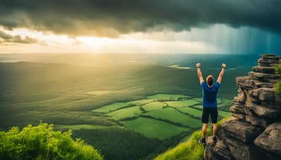 a man standing on a cliff overlooking a valley