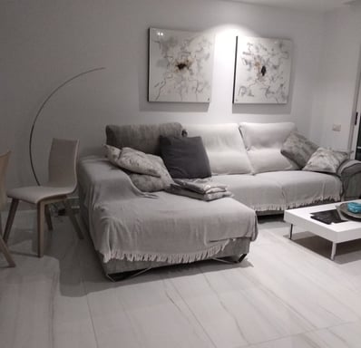 a living room with a couch and a table