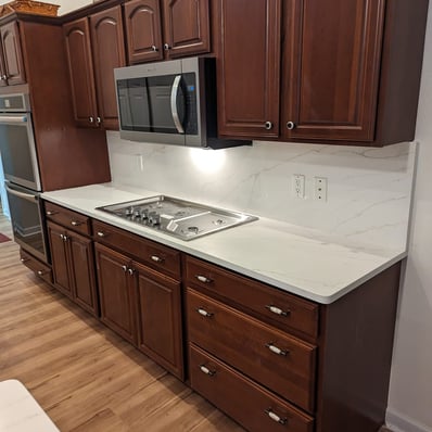 quartz kitchen countertop on brown cabinets