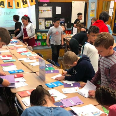 Students share their work with peers.